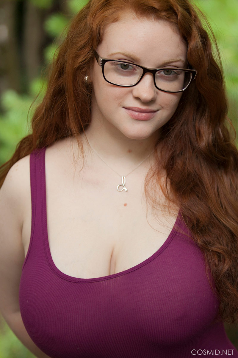 Busty redhead outdoors